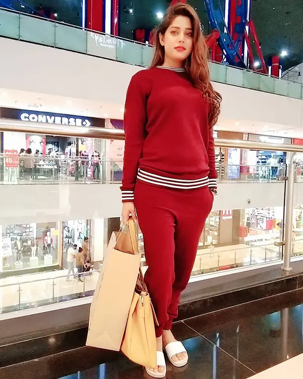 Amanda Sharma in red dress